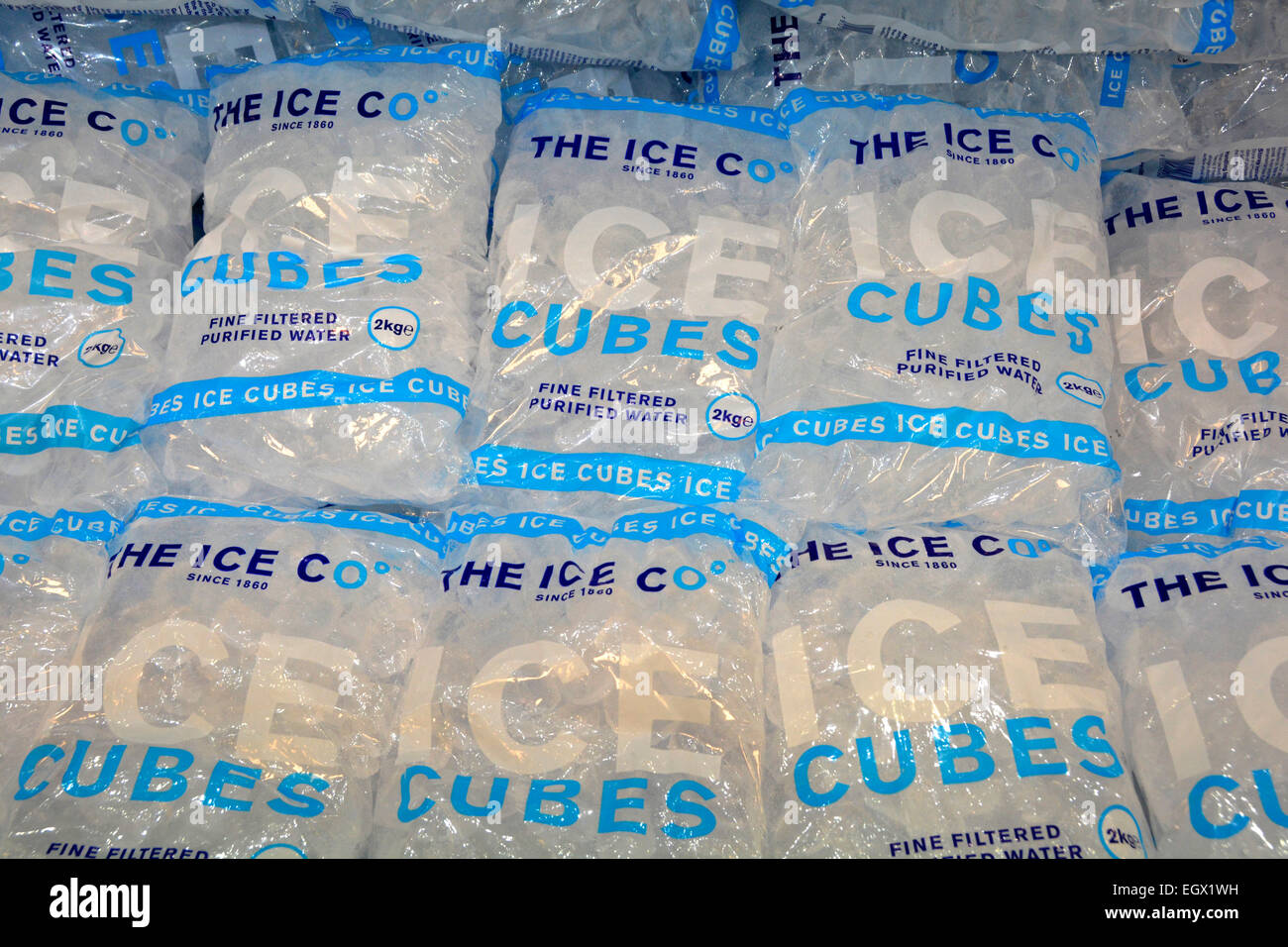 Plastic bags of fine filtered purified frozen water ice cubes in cold ...