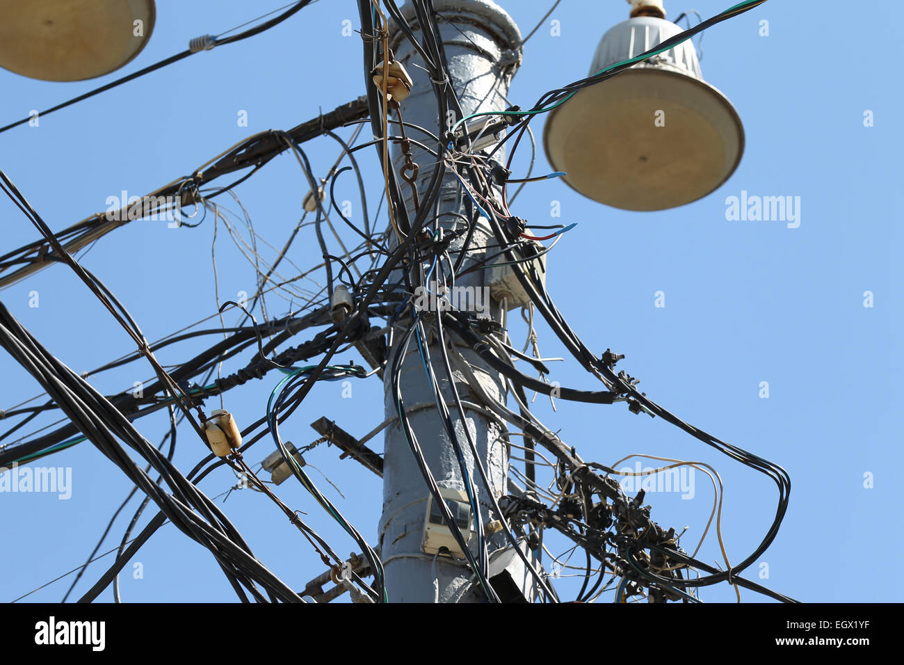 Electric pole switched wires against the blue sky Stock Photo - Alamy