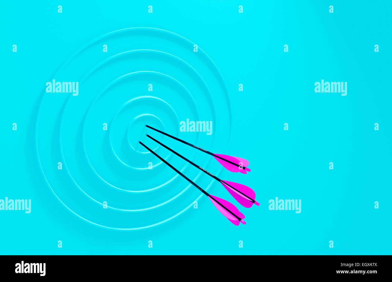Three Arrows In An Abstract Archery Target Stock Photo