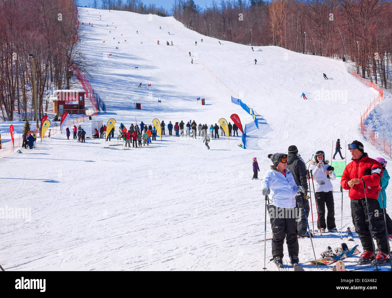 Ontario's Premier Ski Resort  Blue Mountain in Collingwood;Ontario;Canada and the "Village" in the Winter & many people skiing Stock Photo