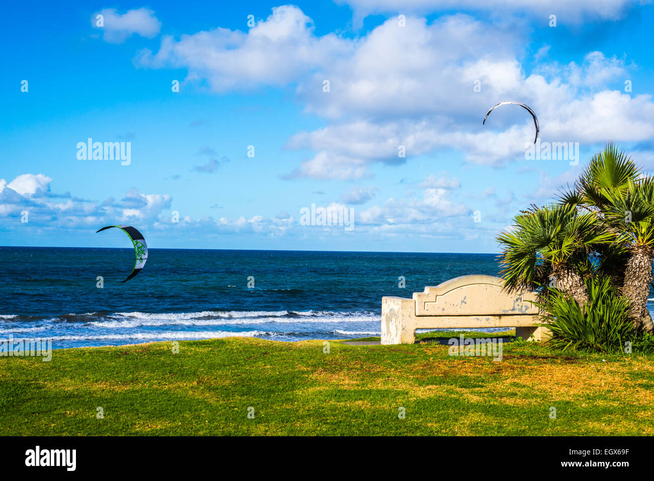 Kiteboarding and a bench at an overlook point above Tourmaline Beach