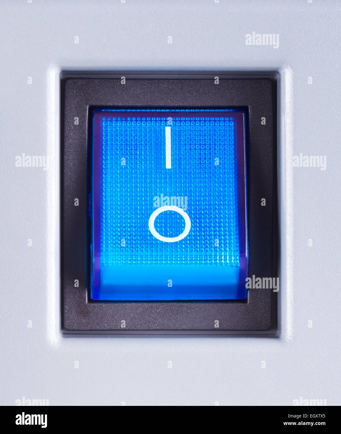 blue power switch button turned on, close up Stock Photo
