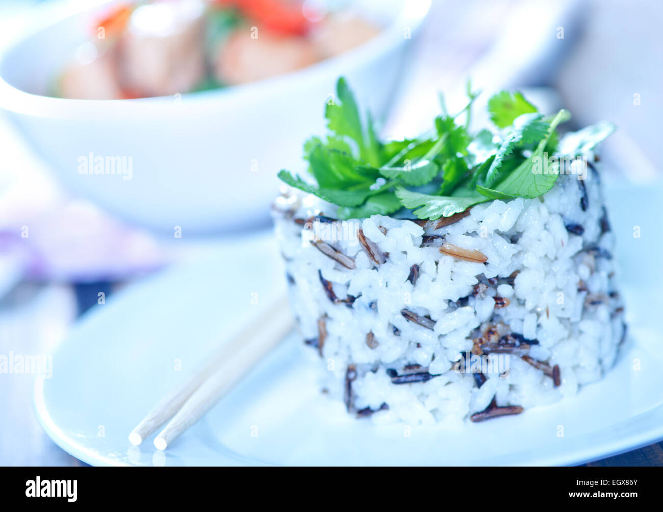 boiled rice on plate and on a table Stock Photo - Alamy