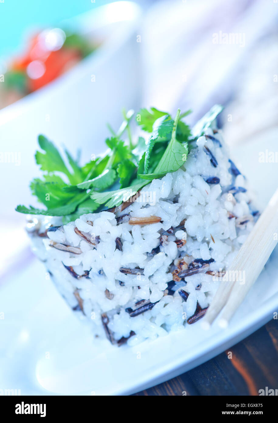 boiled rice on plate and on a table Stock Photo - Alamy