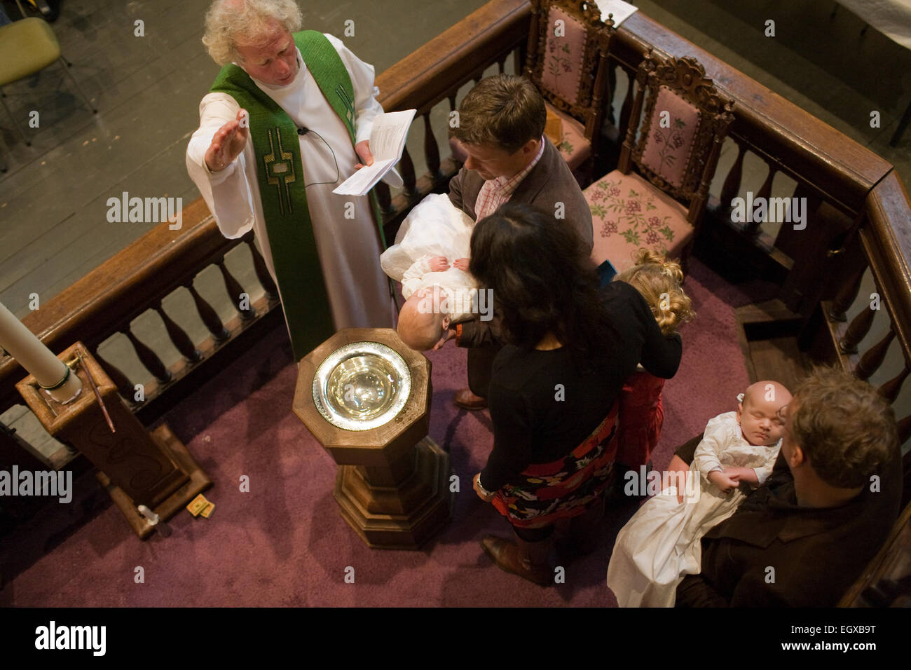 Netherlands. Groningen. Baptizing of four babies in 'De Níeuwe Kerk (The New Church). The church dates back to 1660. Stock Photo