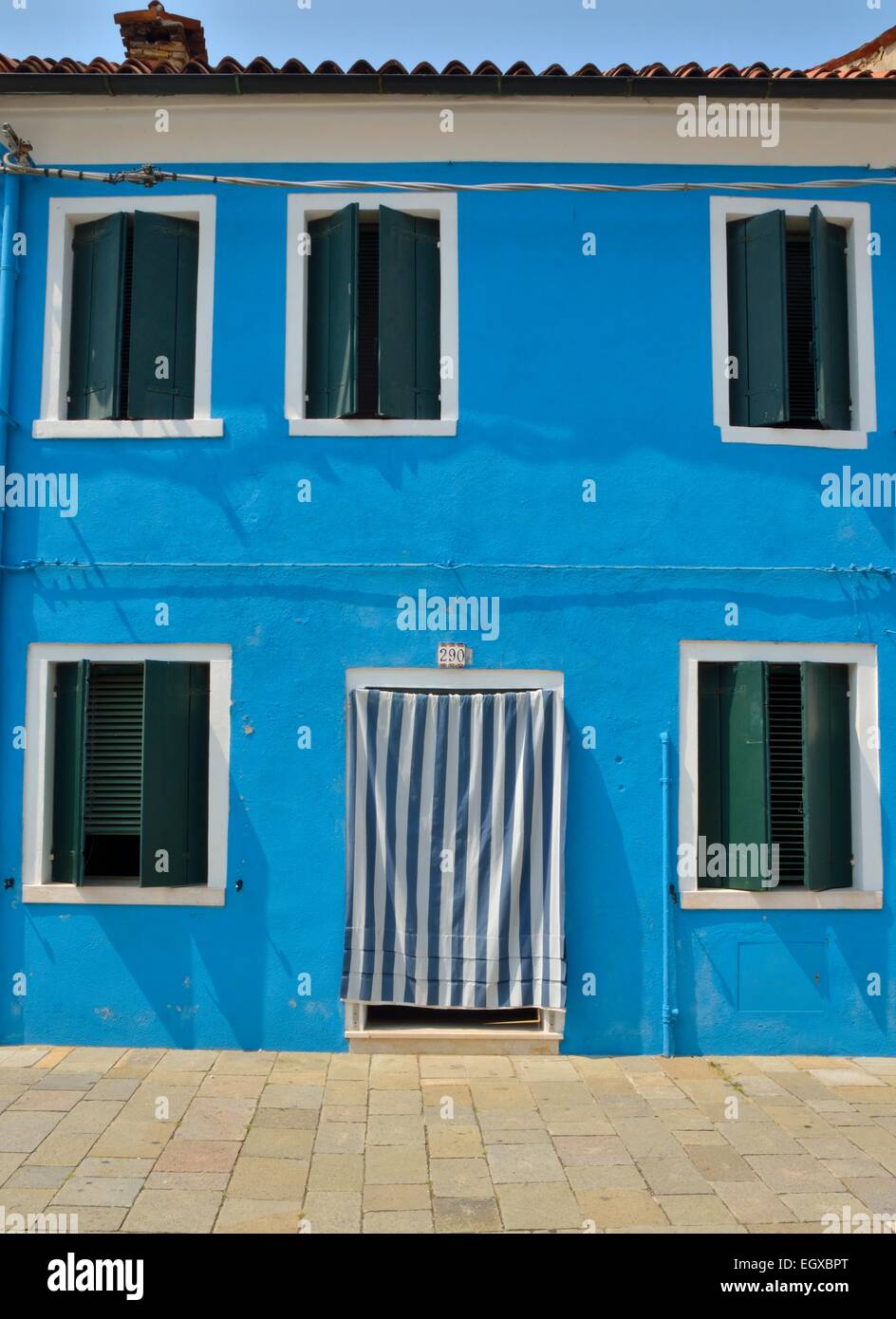 Vibrant blue house in Burano, a fisher island of Venice, Italy Stock ...