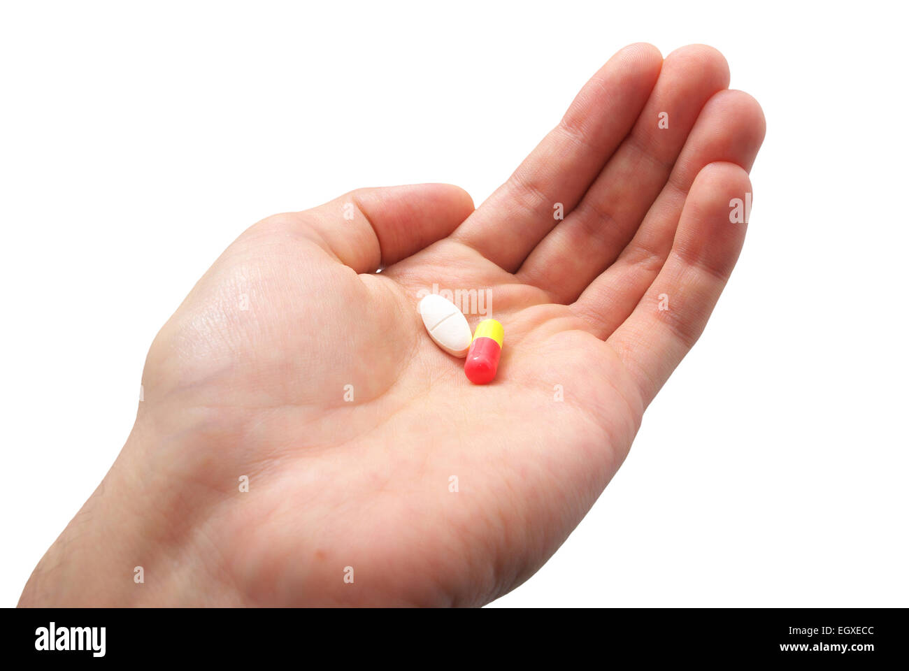 Human palm and two pills. Isolated object. Stock Photo