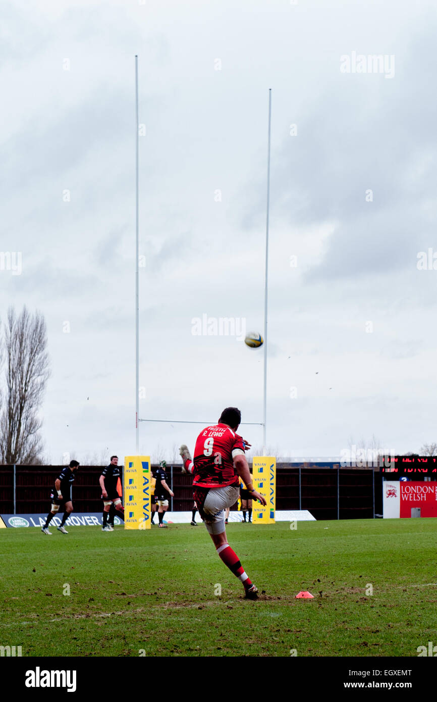 Rugby player kicking a penalty at London Welsh v London Irish Aviva Premiership Rugby match on St Davids Day (1 March 2015) Stock Photo