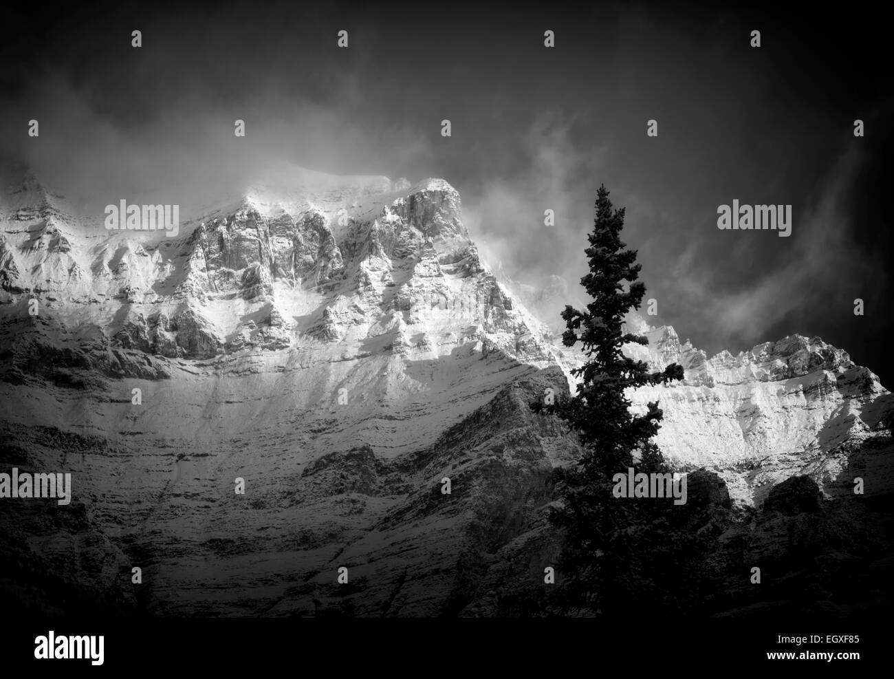 First light on mountain, surrounding Moraine lake with fresh snow. Banff National Park, Alberta, Canada Stock Photo