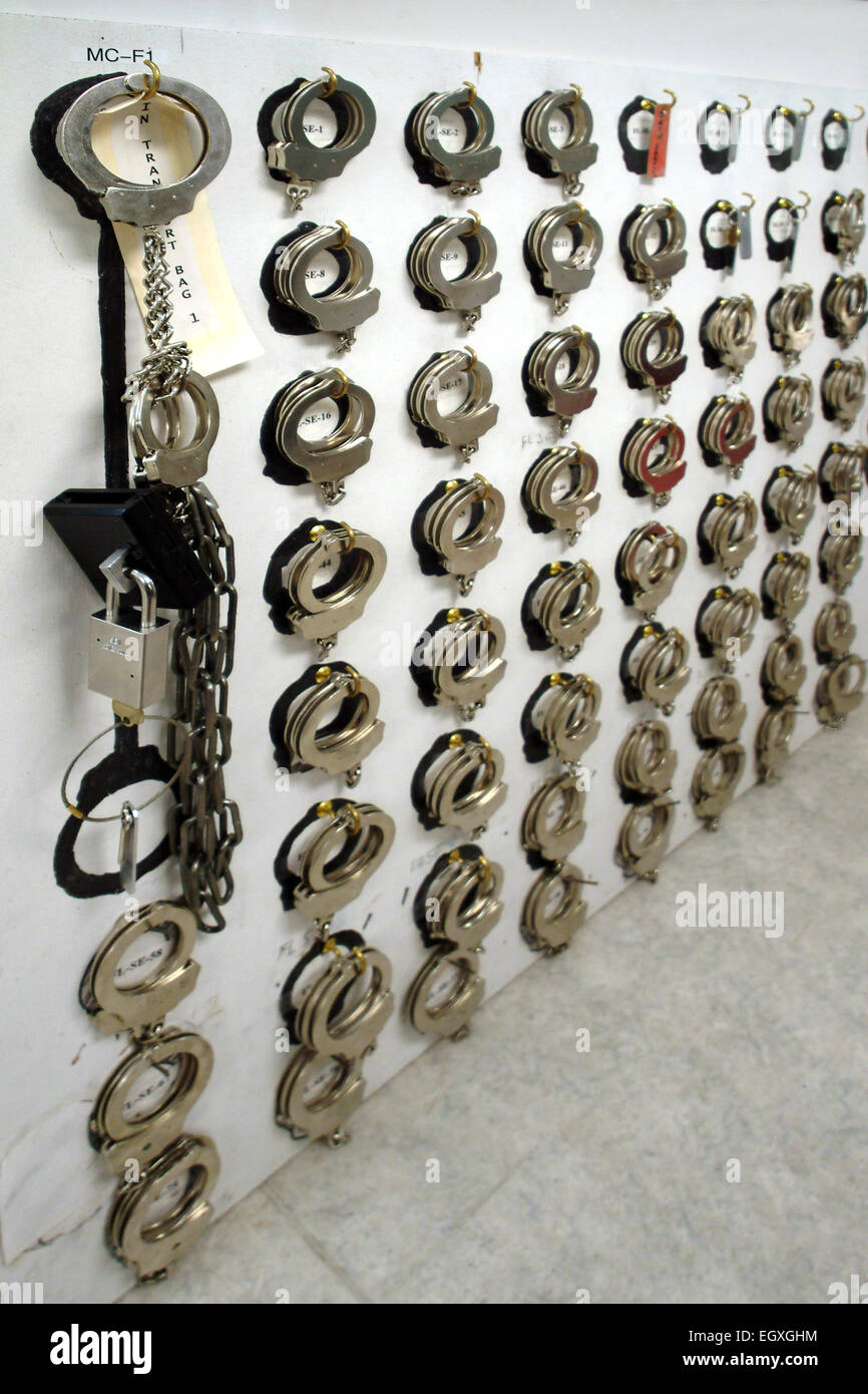 Collection of handcuffs, leg irons and other restraints at a prison Stock Photo