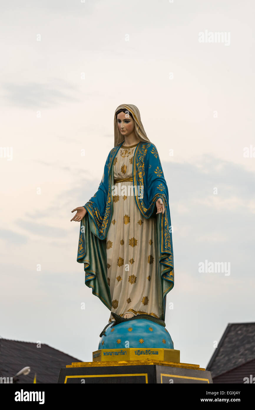 Saint Mary or the Blessed Virgin Mary, the mother of Jesus, in front of the Roman Catholic Diocese or Cathedral of the Immaculat Stock Photo