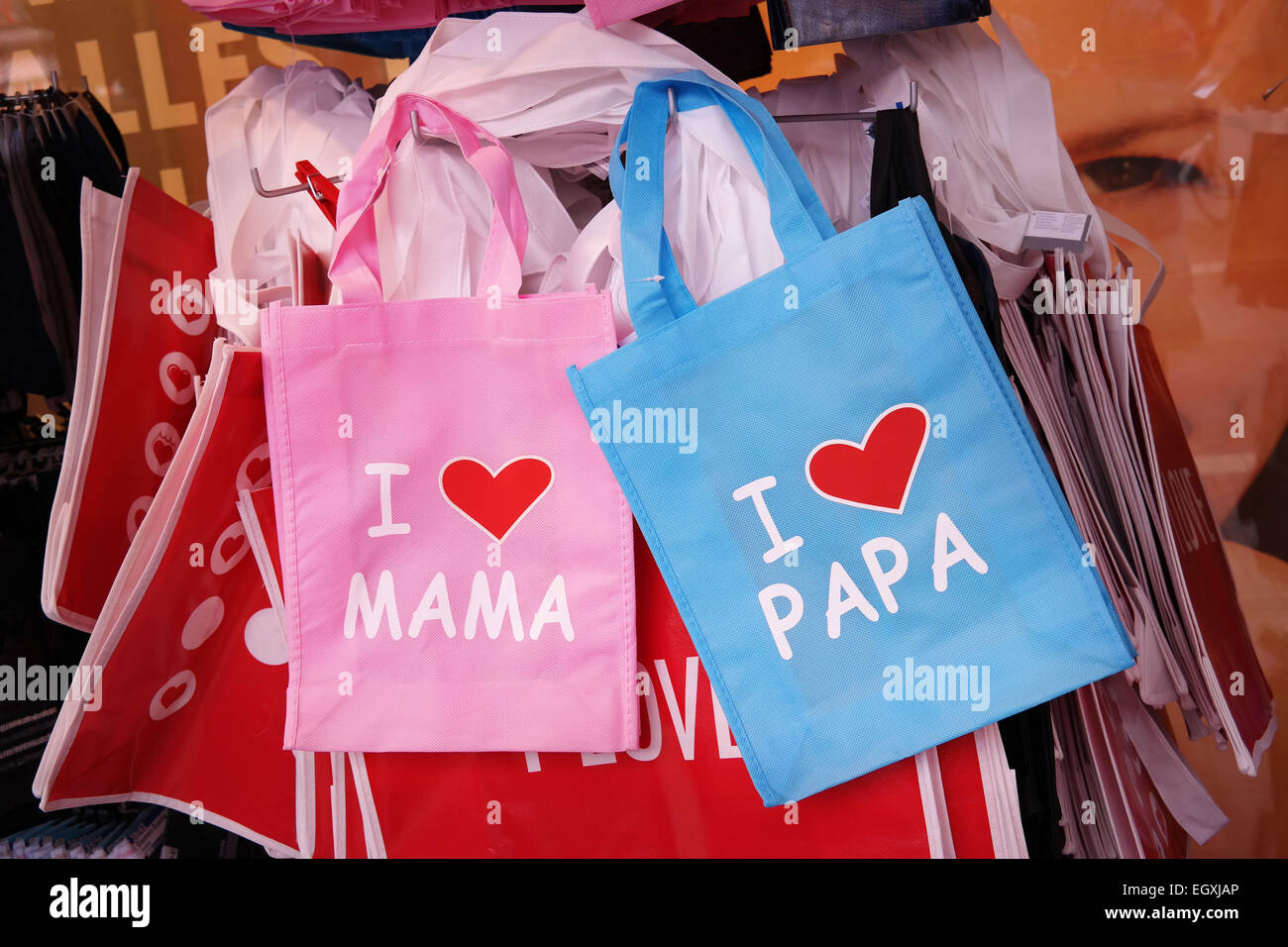 Rack with printed bags: I Love Mama and I Love Papa Stock Photo