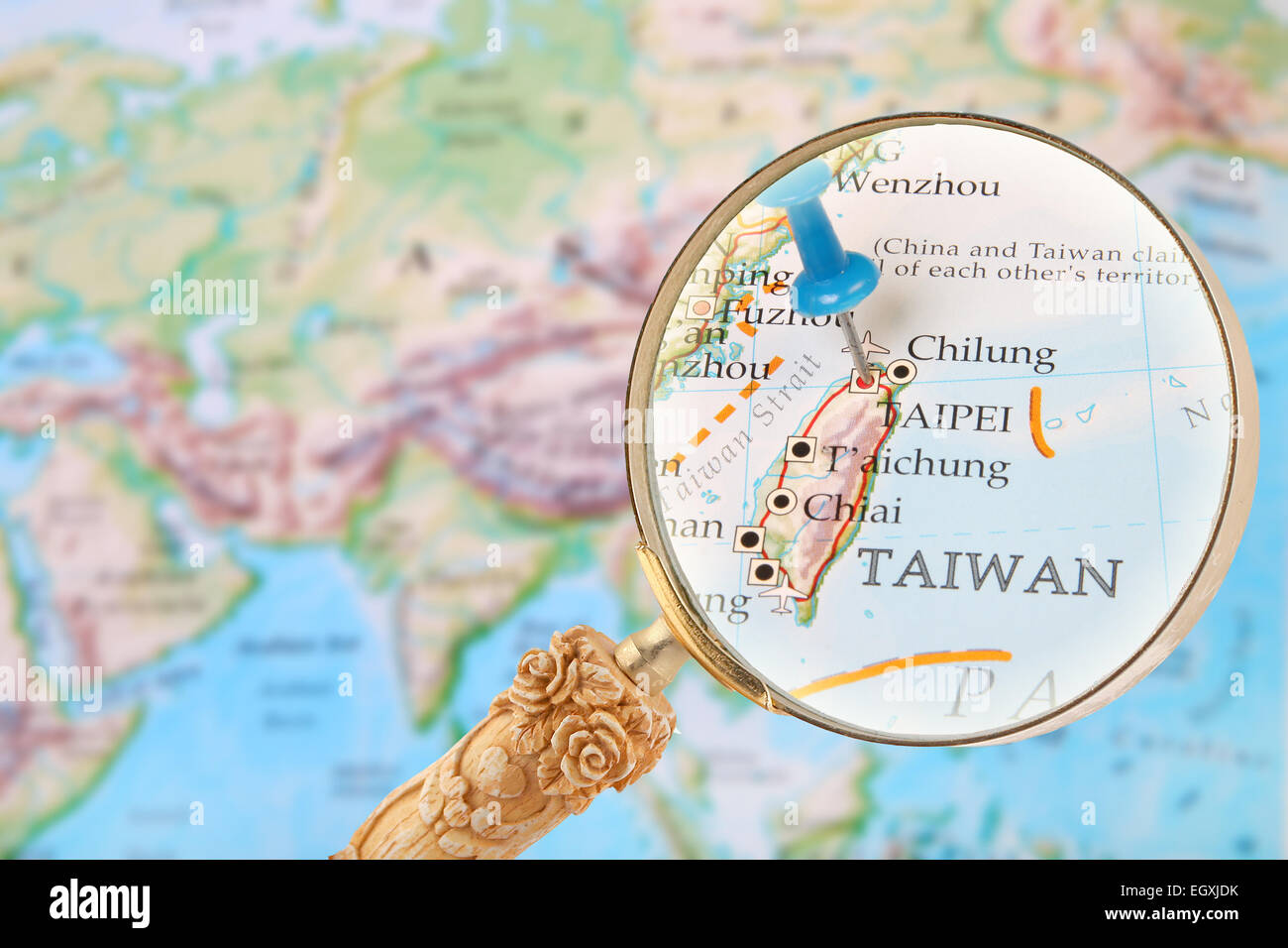 Blue Tack On Map Of The World With Magnifying Glass Looking In On Taipei Taiwan Stock Photo Alamy