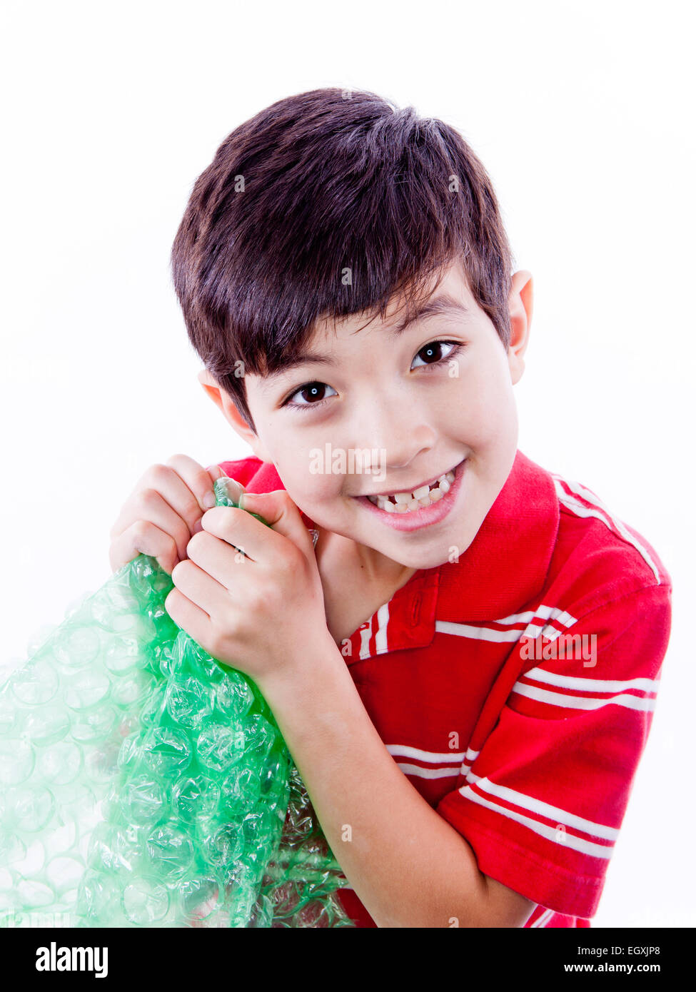 Boy enjoying bubble wrap Stock Photo Alamy