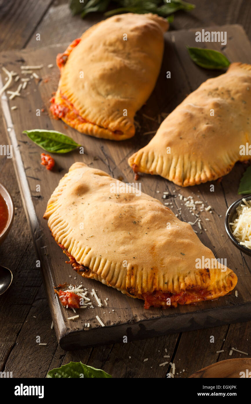 Homemade Italian Meat and Cheese Calzones with Sauce Stock Photo Alamy