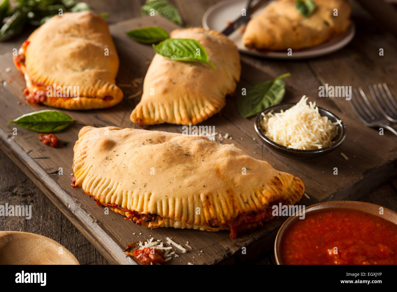 Homemade Italian Meat and Cheese Calzones with Sauce Stock Photo Alamy