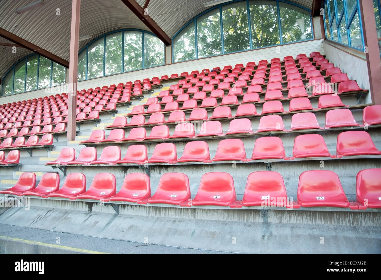 Red seats at soccer sports stadium closeup. Stock Photo
