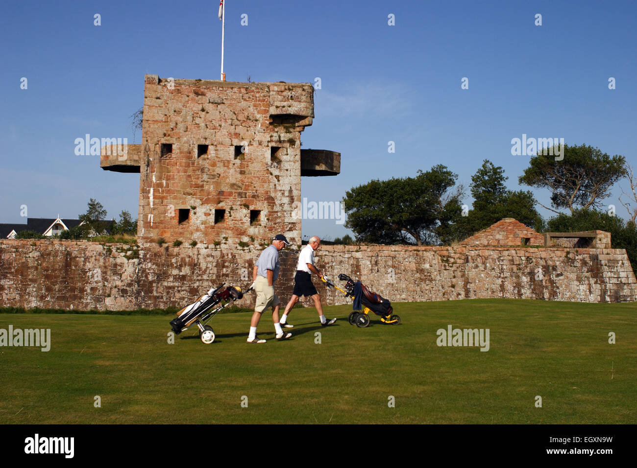 Fort Henry and two golfers / Royal Jersey Golf Club / Jersey / UK Stock Photo
