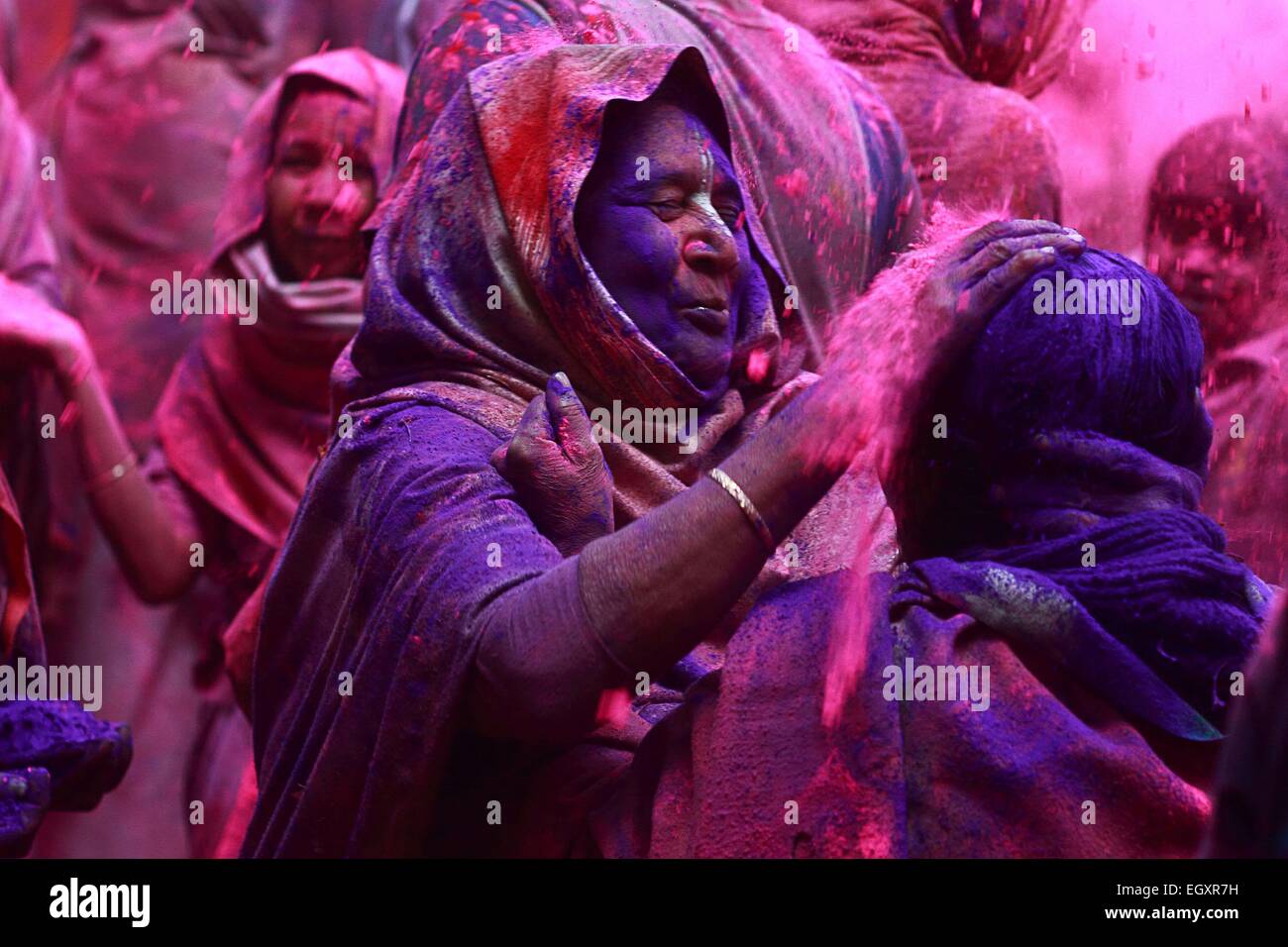 Ashram, Vrindavan, India. 03rd Mar, 2015. Indian widow plays Holi together on Tuesday at century old 'Pagal Baba Ashram' in Vrindavan, India. The widows who normally wear only white sarees, smeared colors on each other and enjoyed the festival with over 1,000 kg 'Gulal' and 1500 kgs of roses and marigold petals which has been arranged for the program. © Shashi Sharma/Pacific Press/Alamy Live News Credit:  PACIFIC PRESS/Alamy Live News Stock Photo