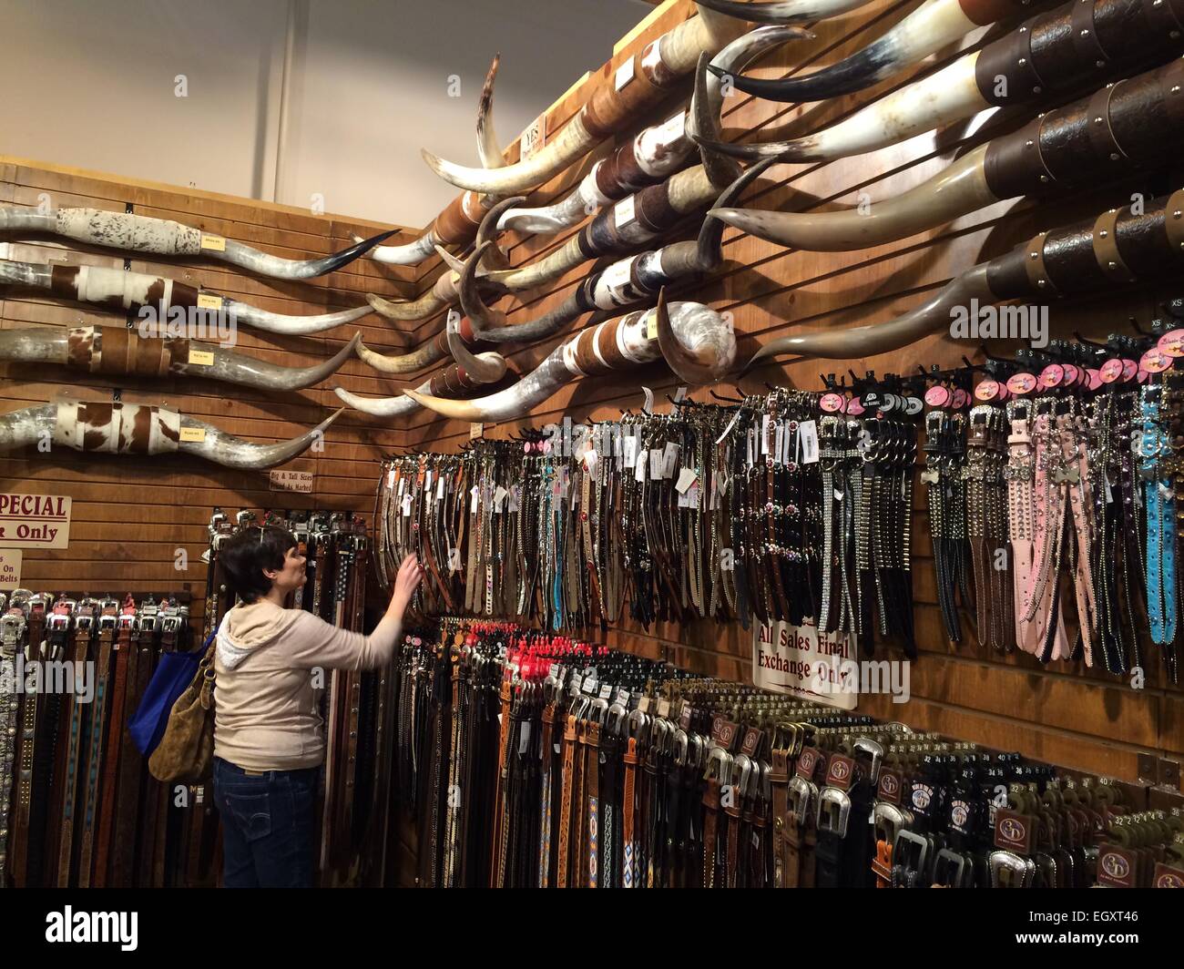 Houston, USA. 3rd Mar, 2015. A woman chooses leather goods during the