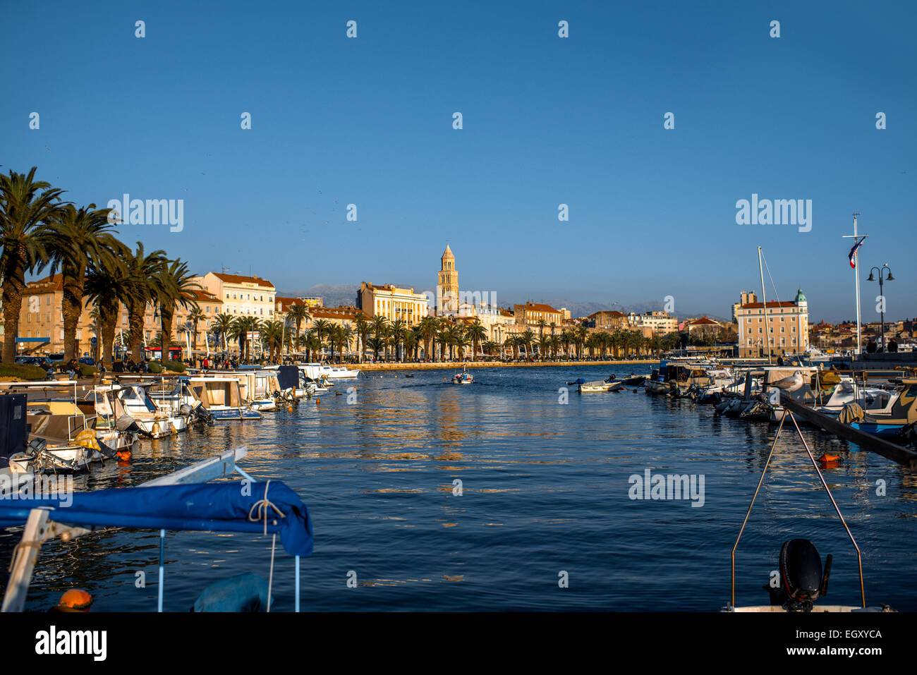 Split city centre view from the quay with boats and yachts in the sunny evening in Croatia Stock Photo