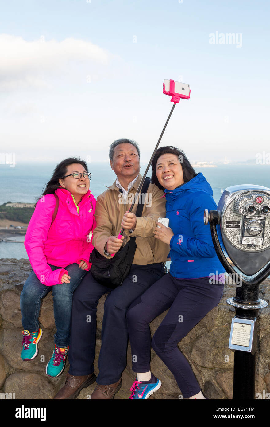 tourists, family, taking selfie, selfie photo, selfie stick, cellphone, Vista Point, north side of Golden Gate Bridge, Sausalito, California Stock Photo