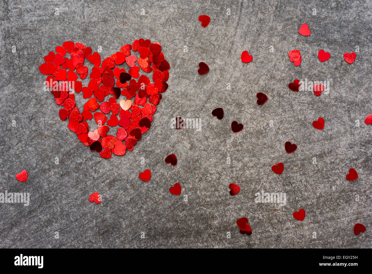 small confetti hearts on the blackboard background Stock Photo