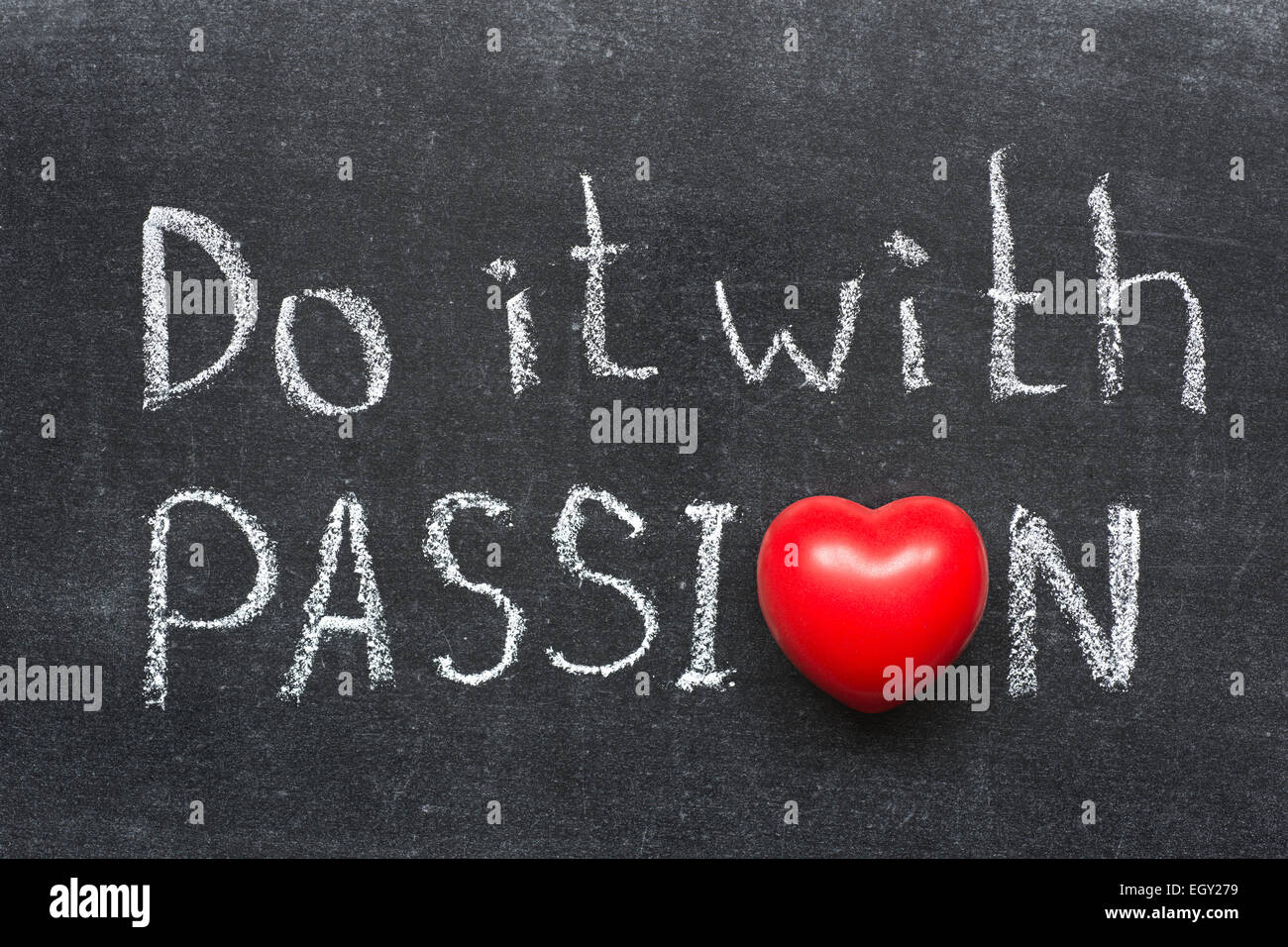 do with passion phrase handwritten on blackboard with heart symbol instead of O Stock Photo