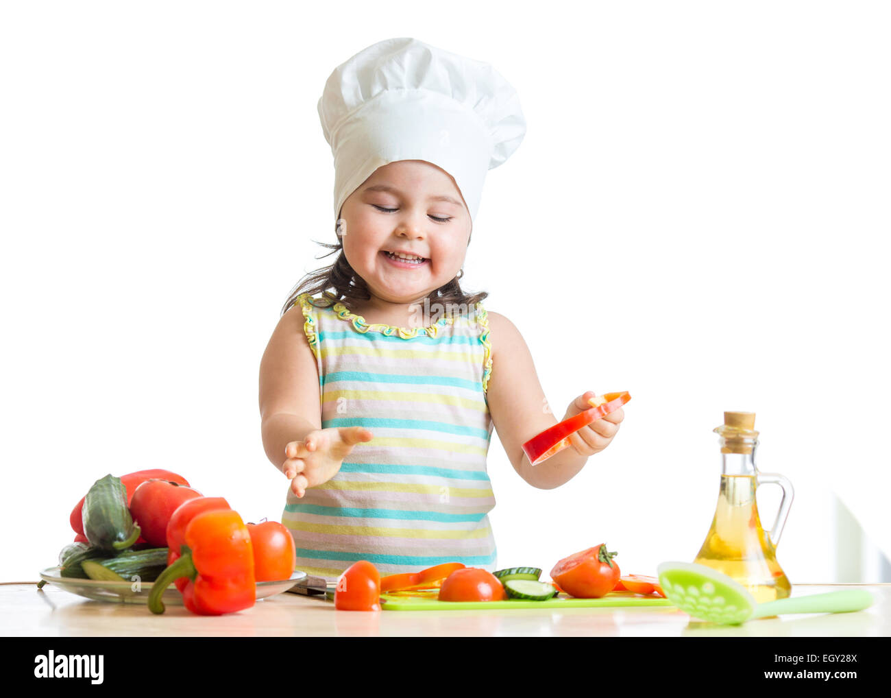 child girl preparing healthy food in the kitchen Stock Photo