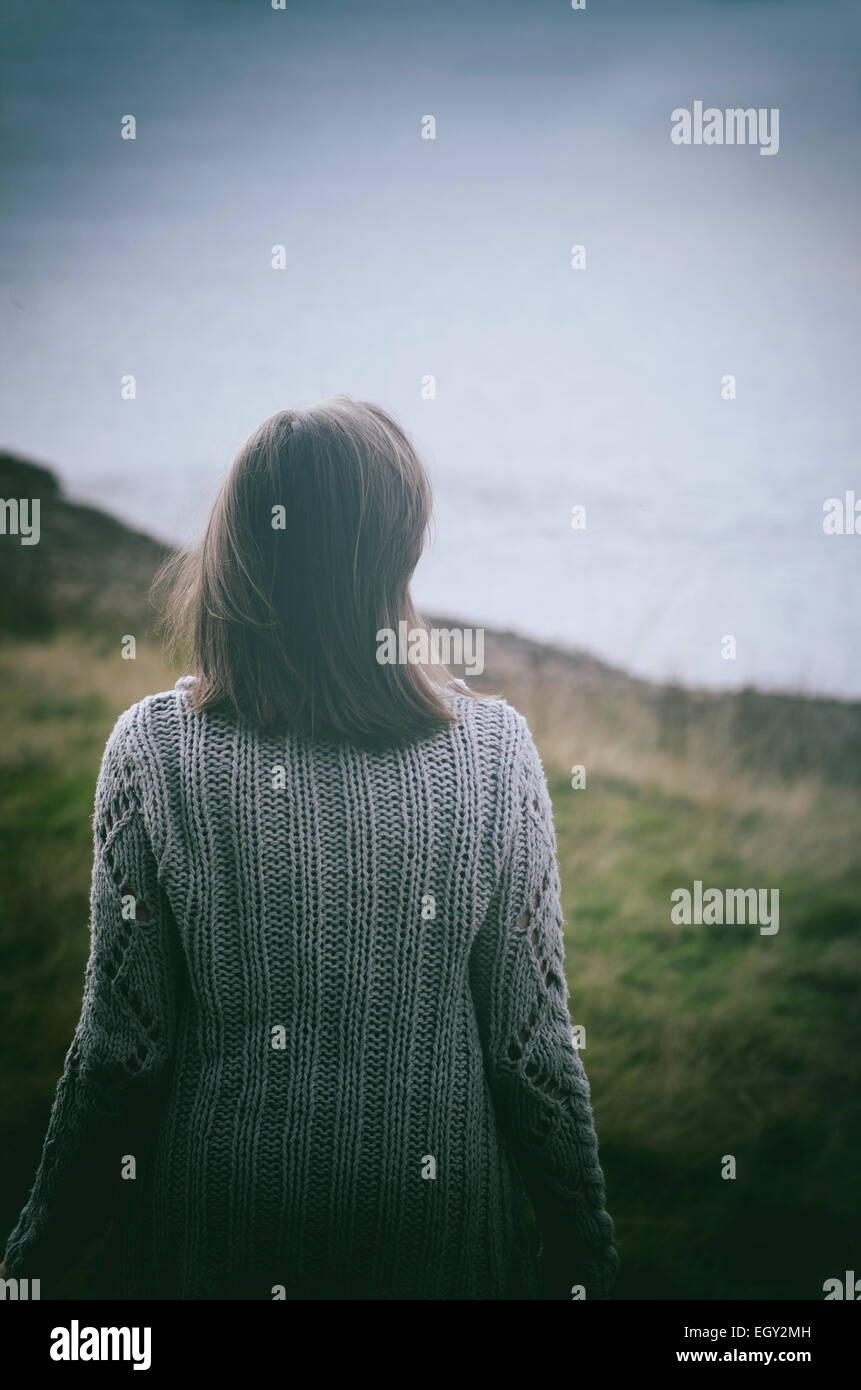 Young woman standing in the countryside Stock Photo