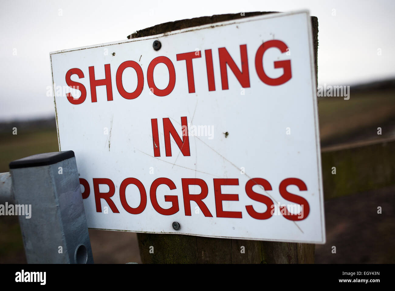 A shooting in progress sign. Stock Photo