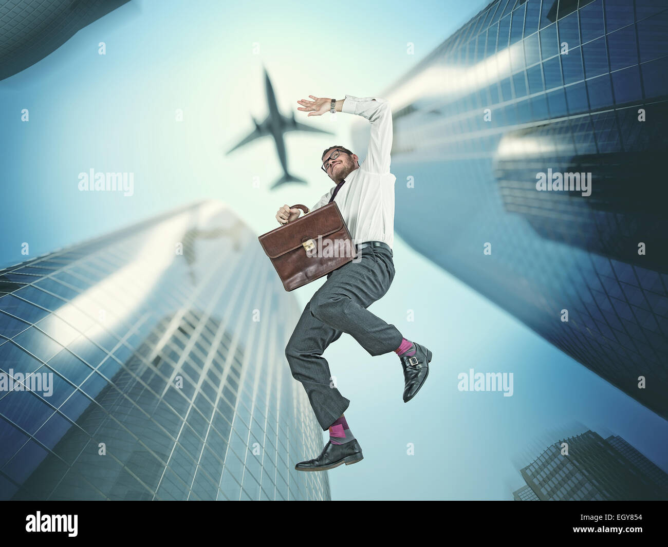 falling businessman and skyscraper background Stock Photo