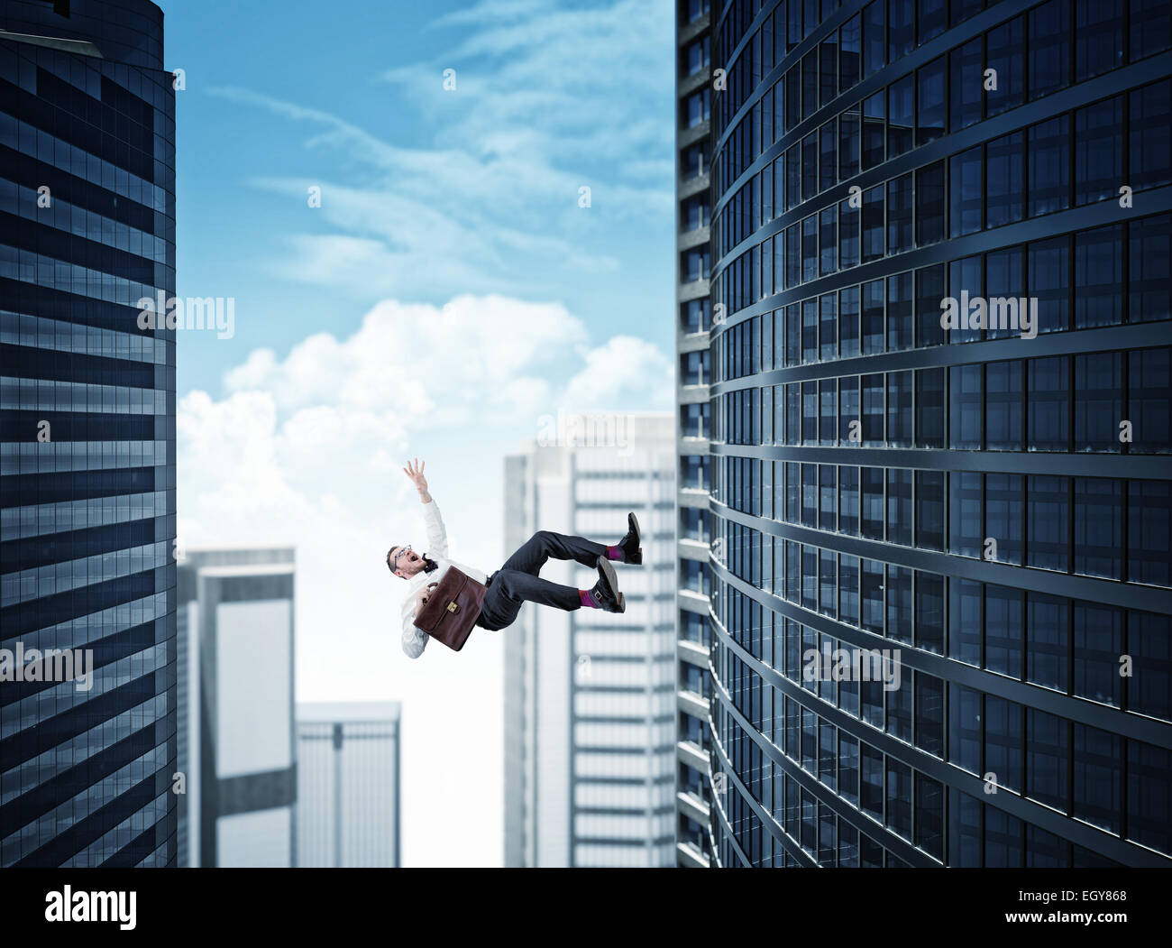 skyscaper background and falling business man Stock Photo