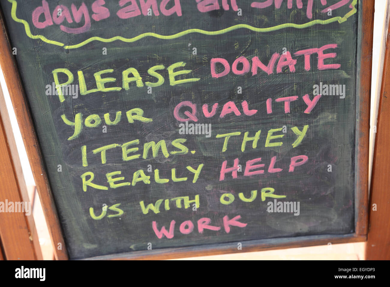 Chalkboard asking for donations to charity shop Stock Photo Alamy