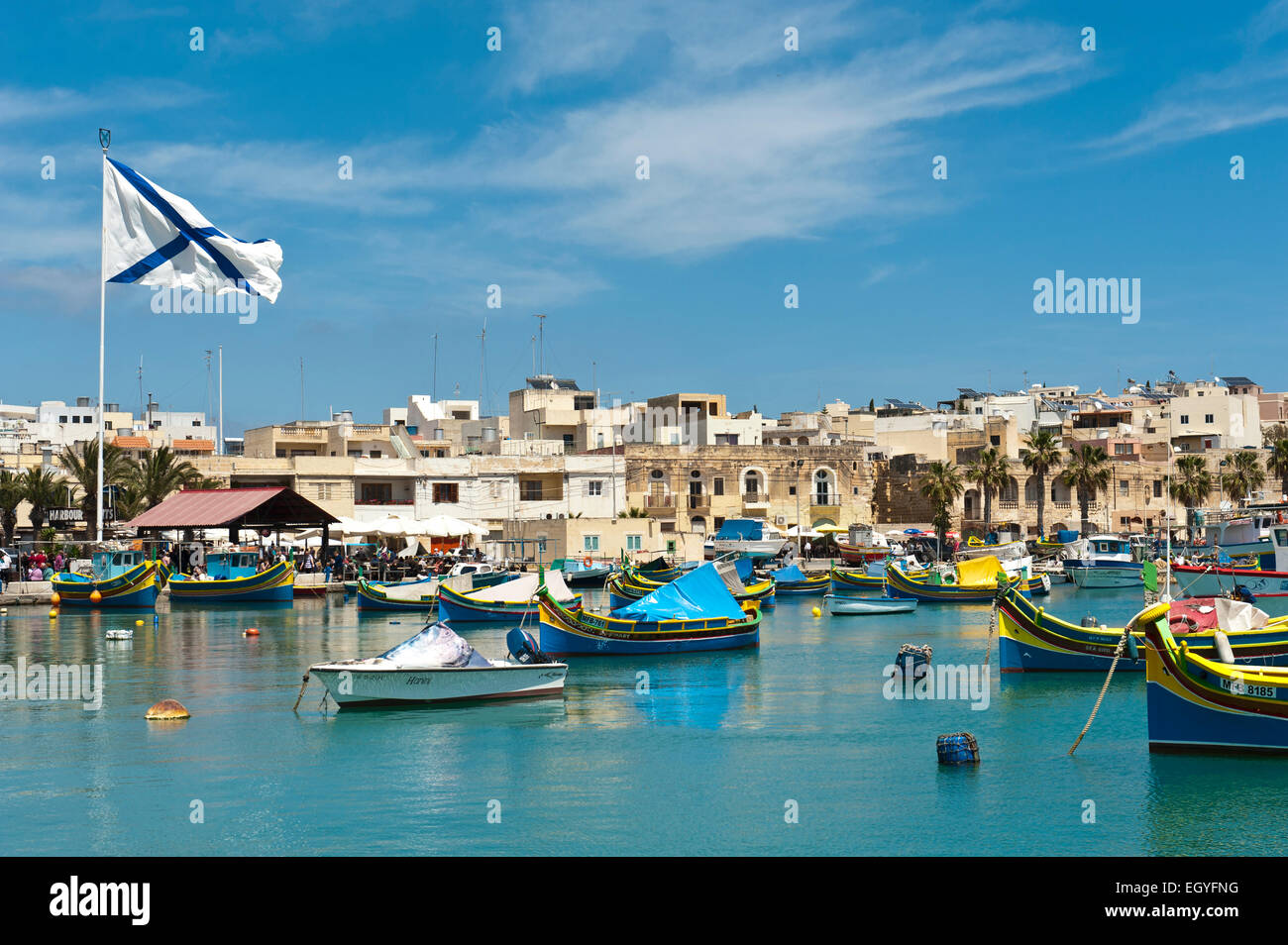 Colorfully painted traditional fishing boats, Luzzu, harbour of Marsaxlokk, Malta Stock Photo