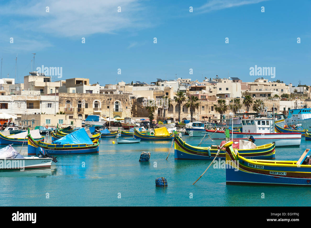 Colorfully painted traditional fishing boats, Luzzu, harbour of Marsaxlokk, Malta Stock Photo