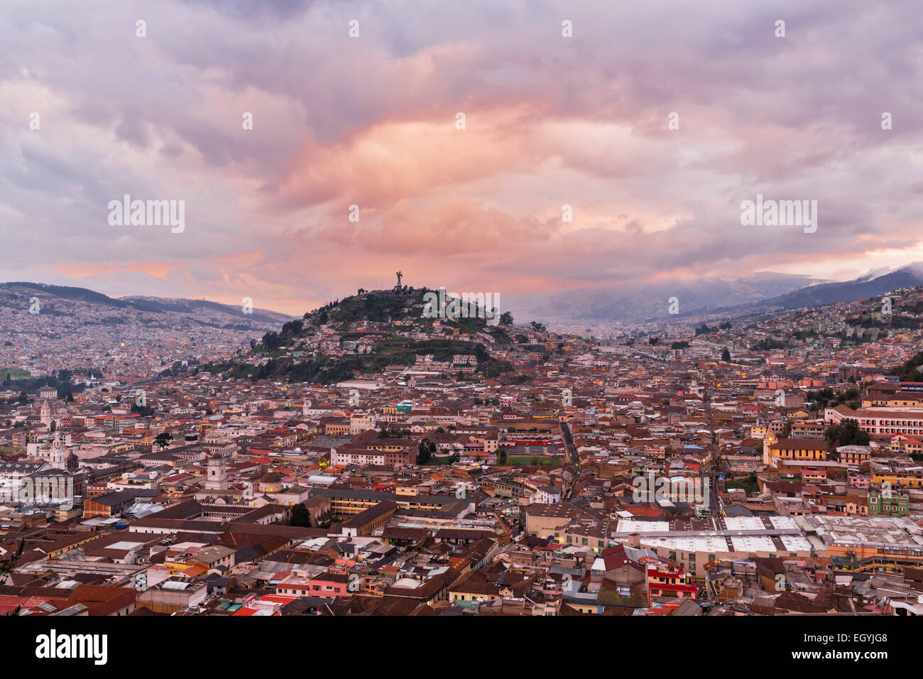 Ecuador, Quito, cityscape with El Panecillo at sunset Stock Photo