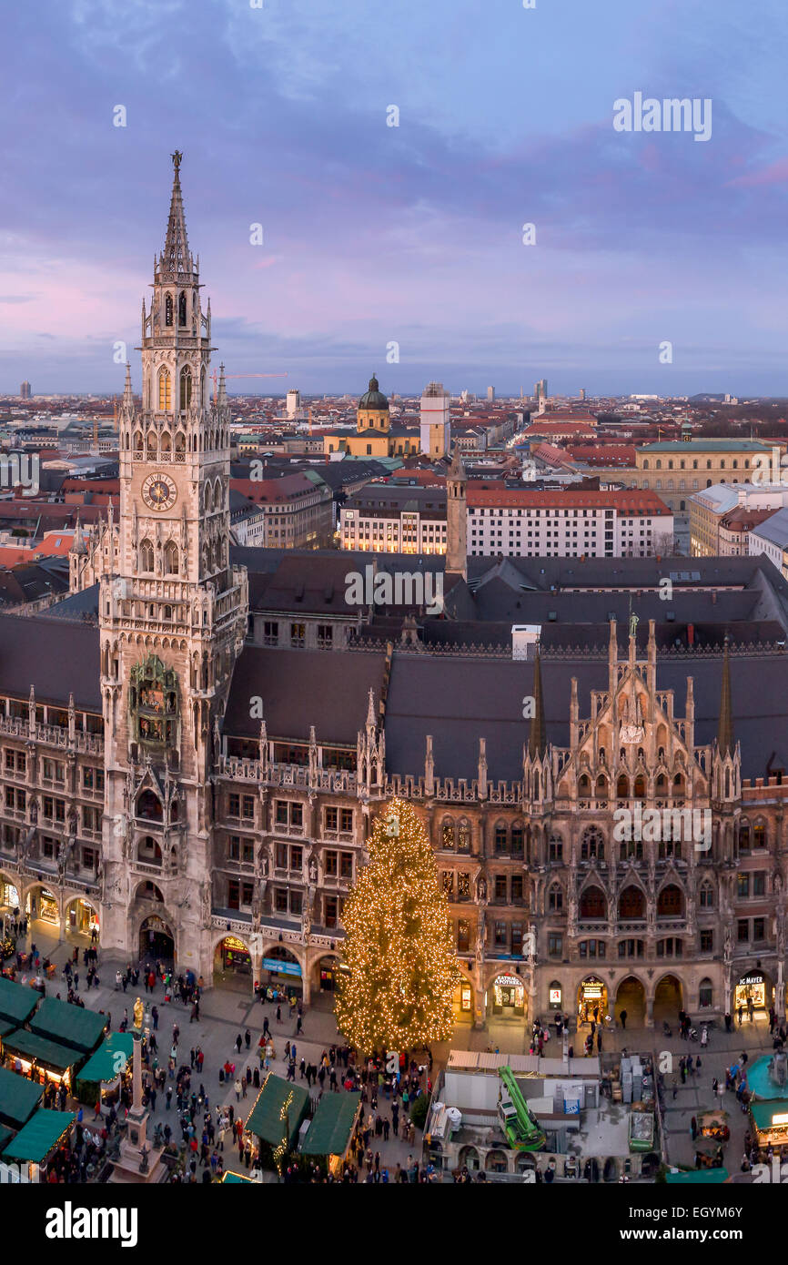 Germany, Munich, Christmas market at townhall square in the evening Stock Photo