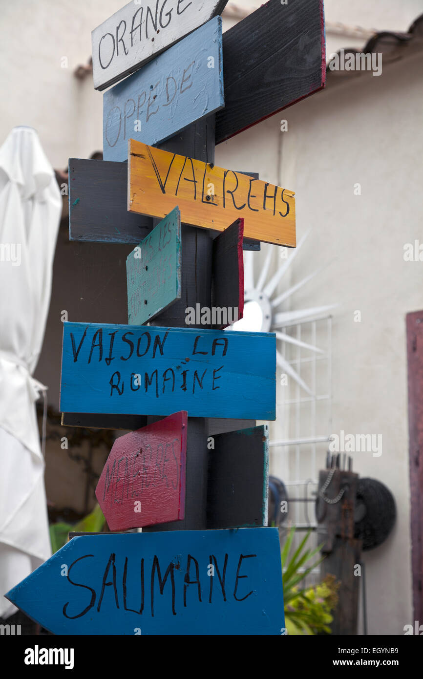Handcrafted road sign for sale in an antique shop,
