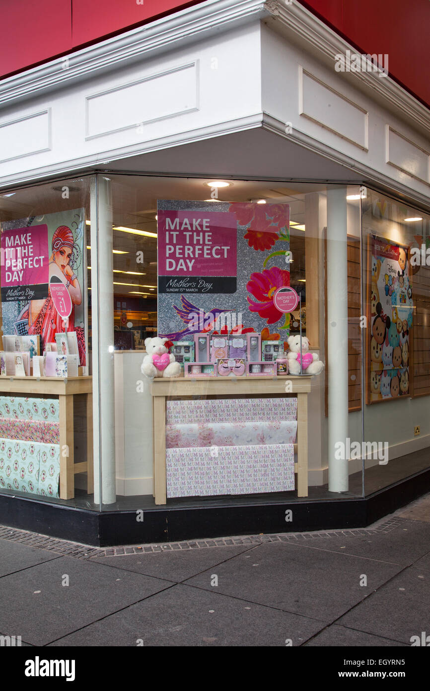 Clintons Cards Mother's Day promotion, selling greeting cards & shop window display in Chapel Street. Mother's Day is a modern celebration originating in North America, honoring one's own mother, and motherhood, maternal bonds, and the influence of mothers in society. Stock Photo