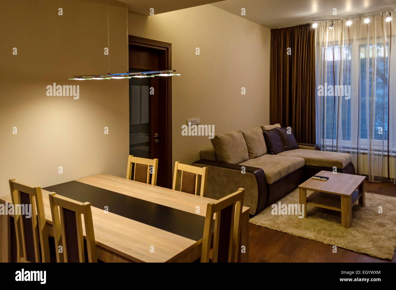 Living room diningtable in renovated apartment with modern LED