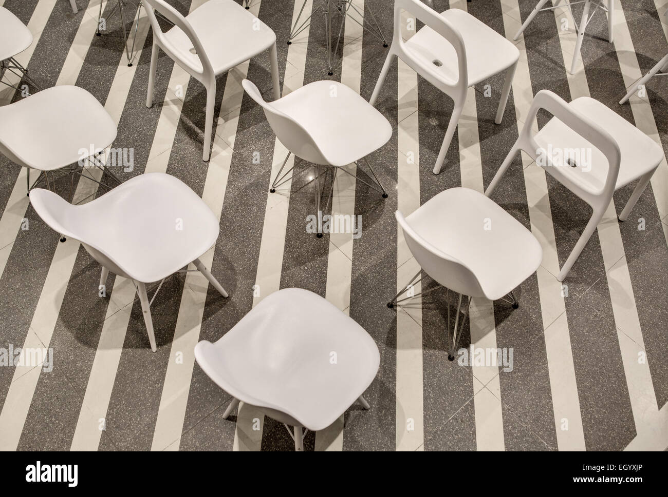 Row of white plastic chairs, top view. Stock Photo
