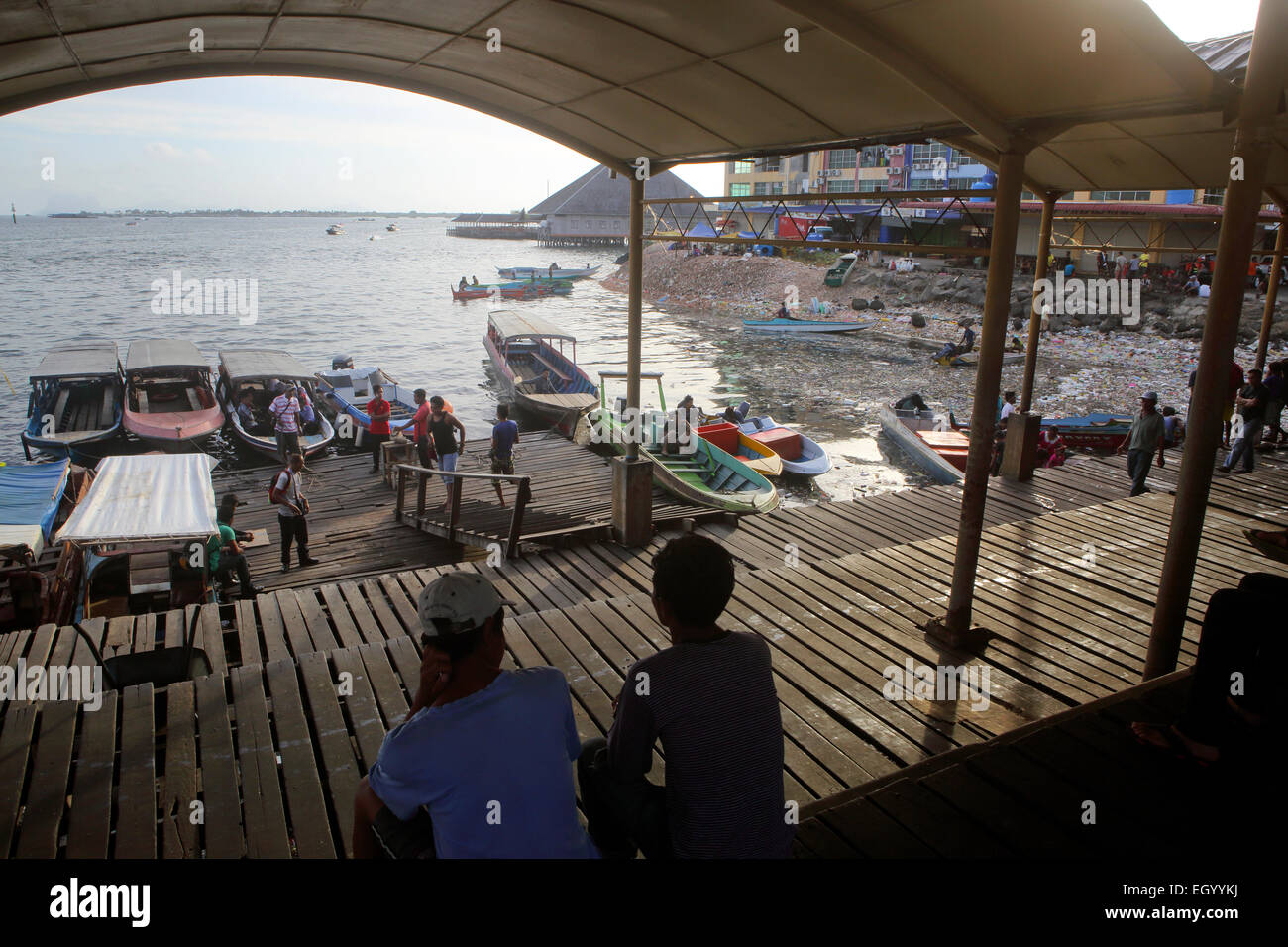 Afternoon boat activity on Semporna waterfront, Borneo Stock Photo