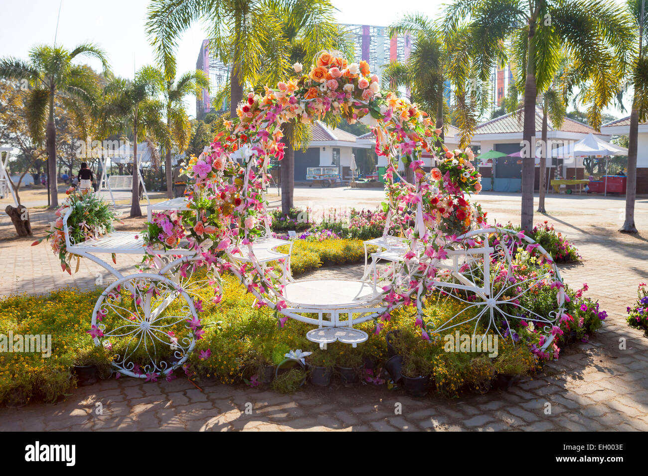 The chair was designed like a tricycle and was decorated with flowers. Stock Photo