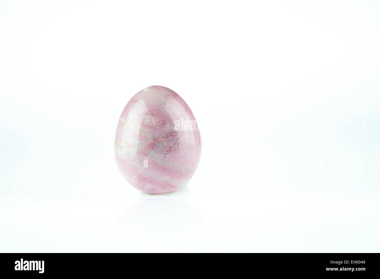 Rose Quartz egg shaped massage gemstone on white background Stock Photo -  Alamy