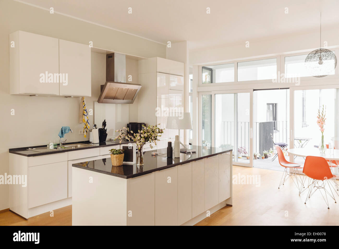 Kitchen with counter island and table in modern building Stock Photo