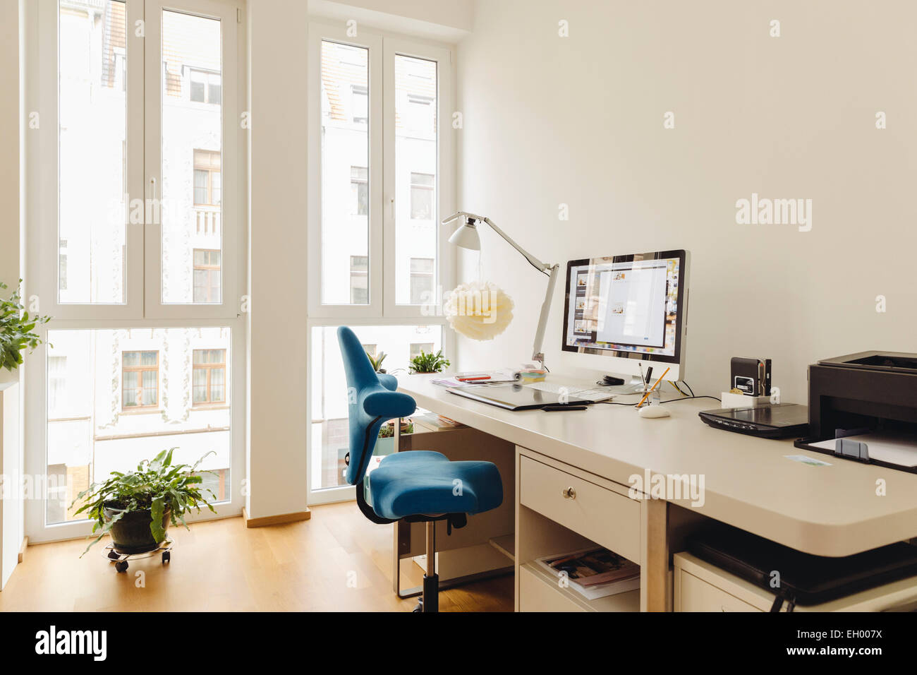 Home office with computer desk in modern building Stock Photo