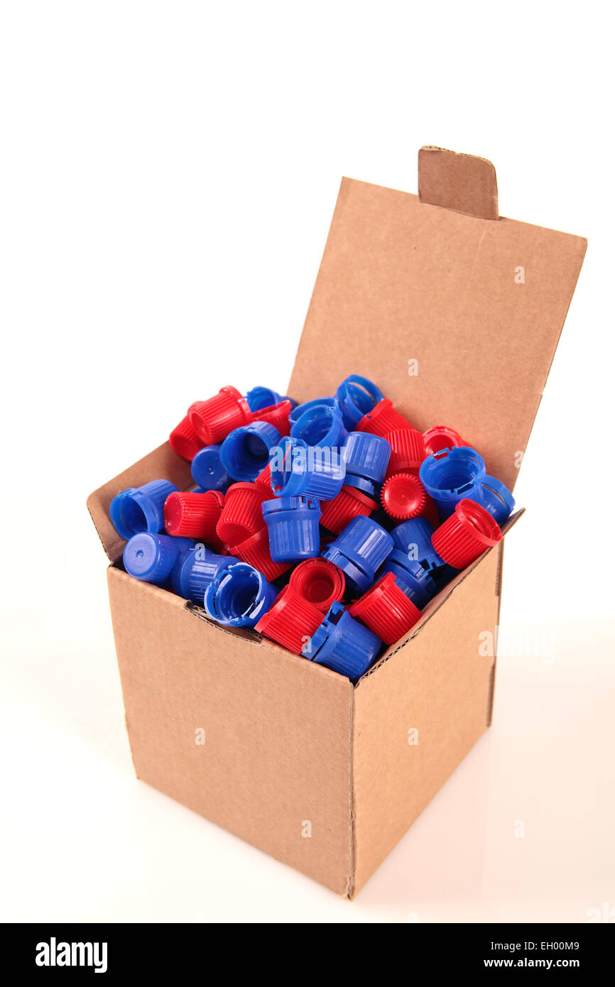 a paperboard box with a lot of caps for recycle on a white background