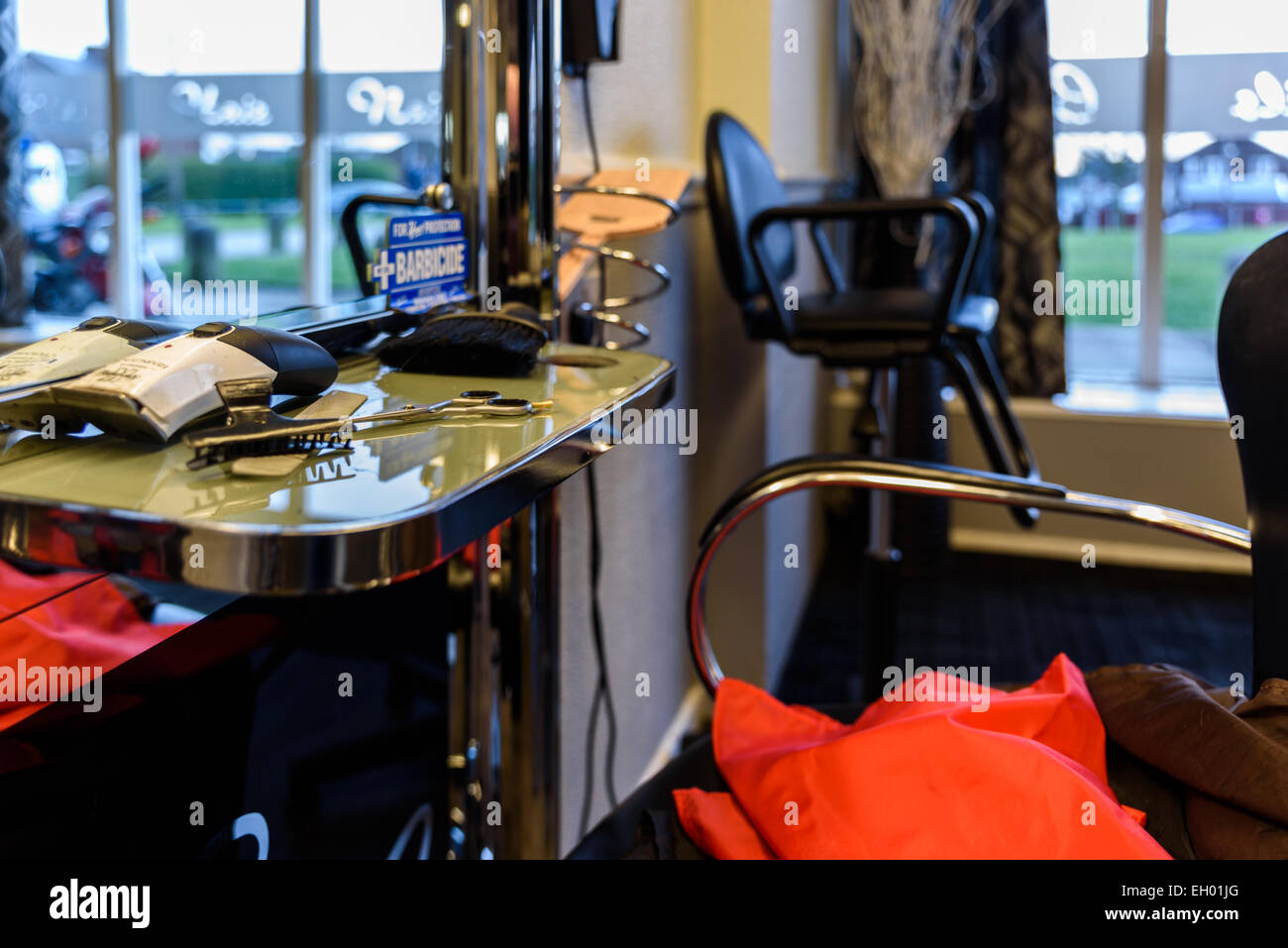 Scissors on a salon counter Stock Photo Alamy