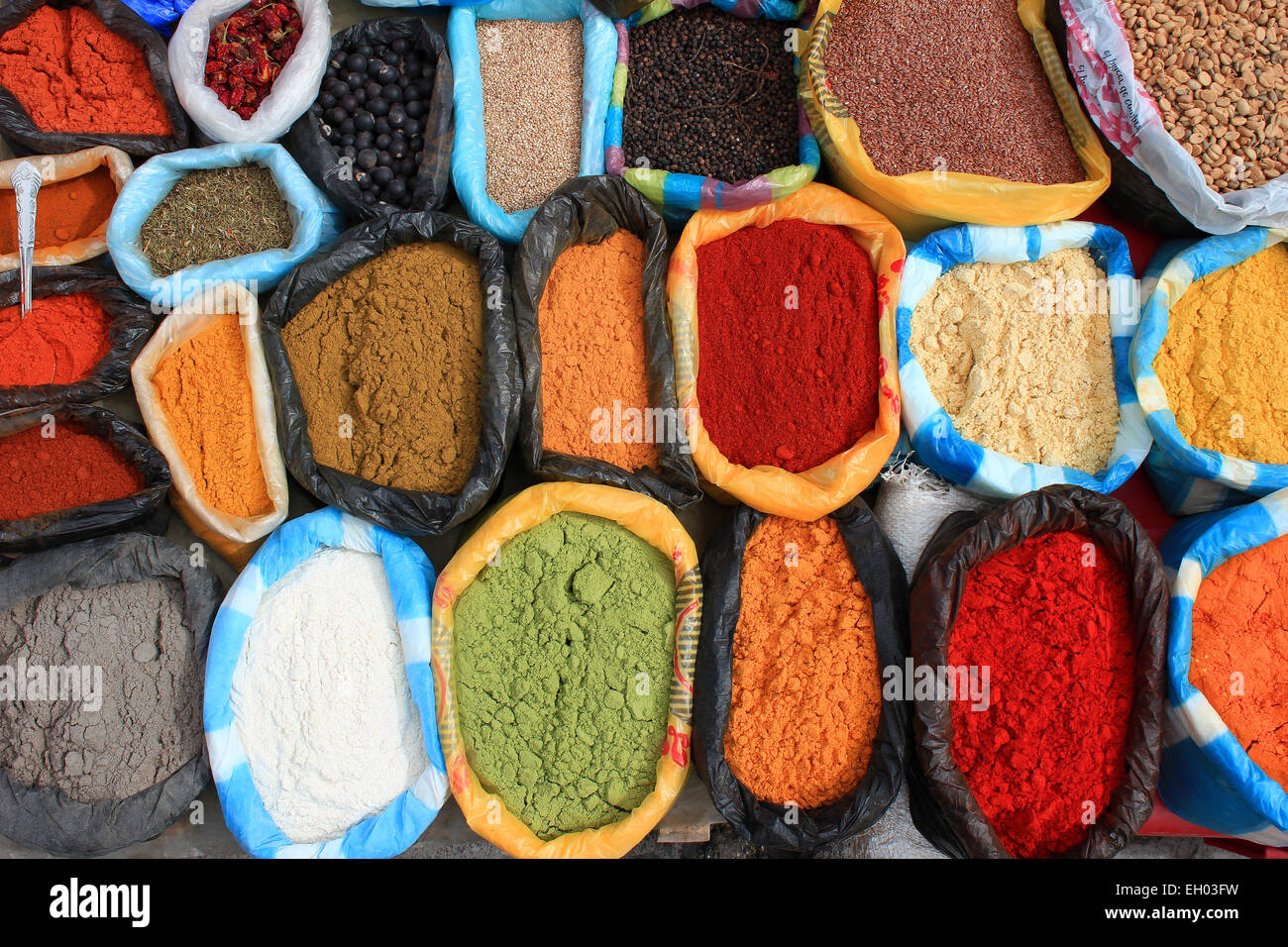 Colorful spices for sale at the outdoor spice market in Otavalo, Ecuador Stock Photo